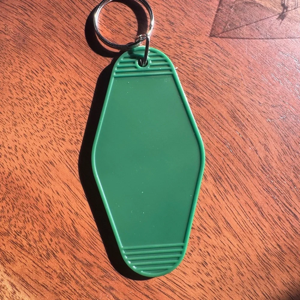 Stay Spooky Motel Keychain | Green | Skeleton Hand Rock Sign